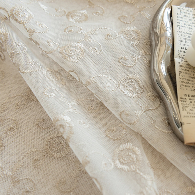 a close up of a cloth with a book on it