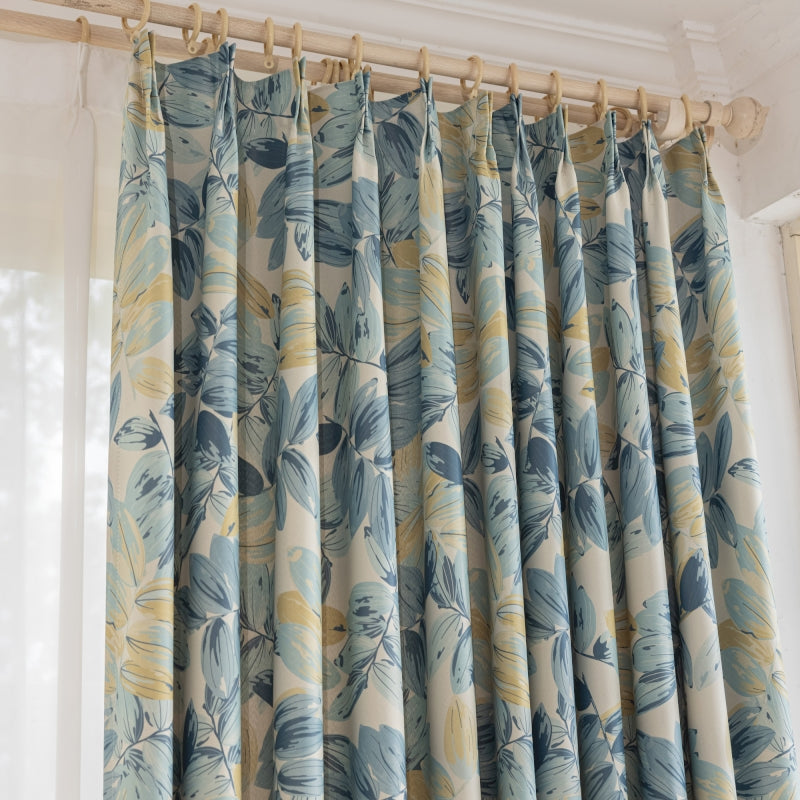 a curtain with a blue and yellow flower pattern
