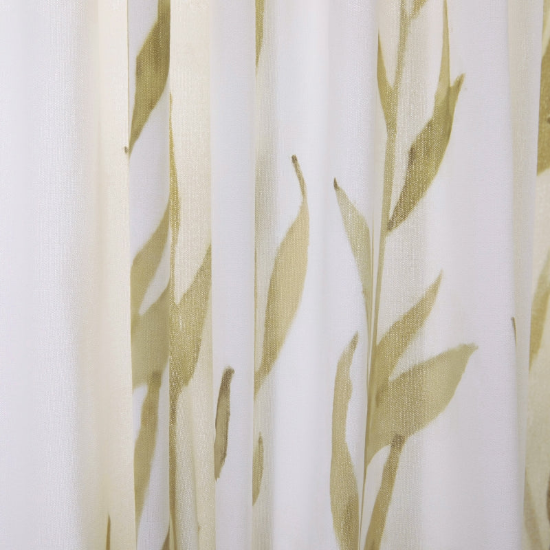 a close up of a curtain with leaves on it