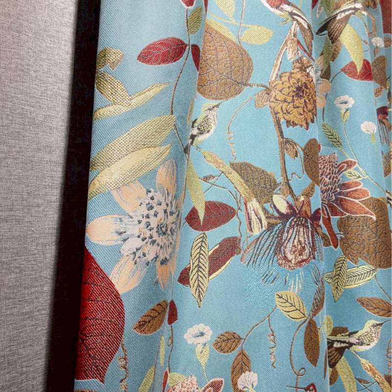 a close up of a curtain with flowers on it
