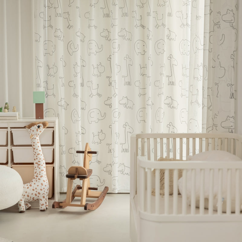 a baby's room with a rocking horse and crib