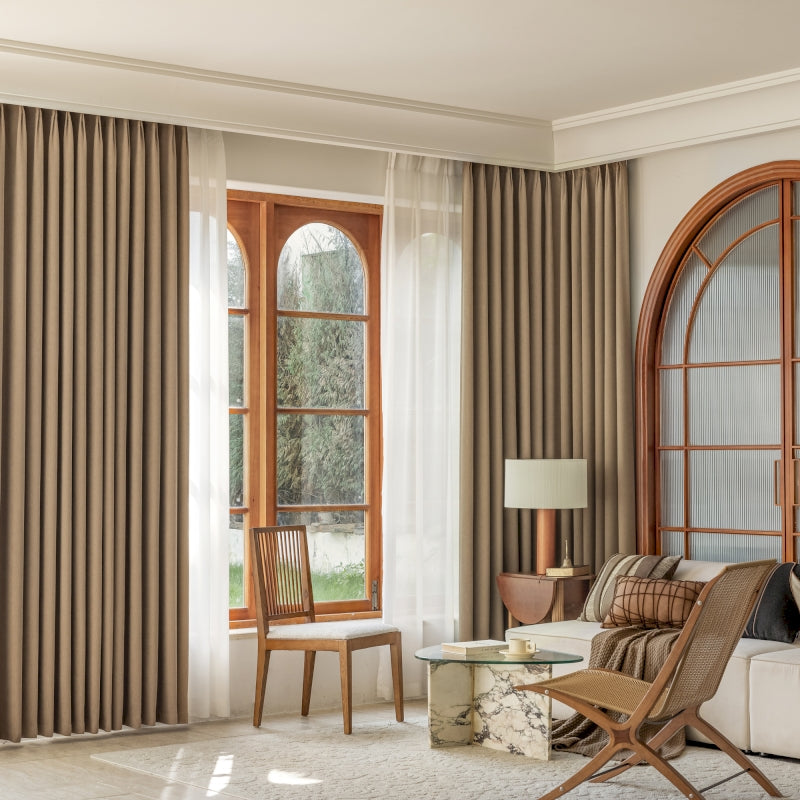 a living room filled with furniture and a large window