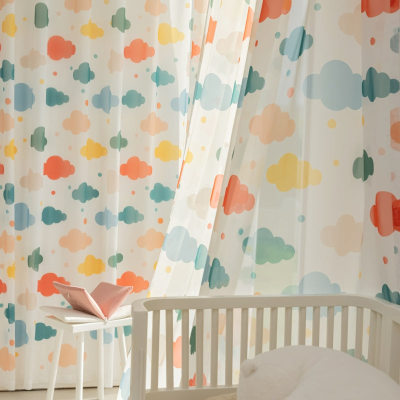 a baby's room with a crib and curtains