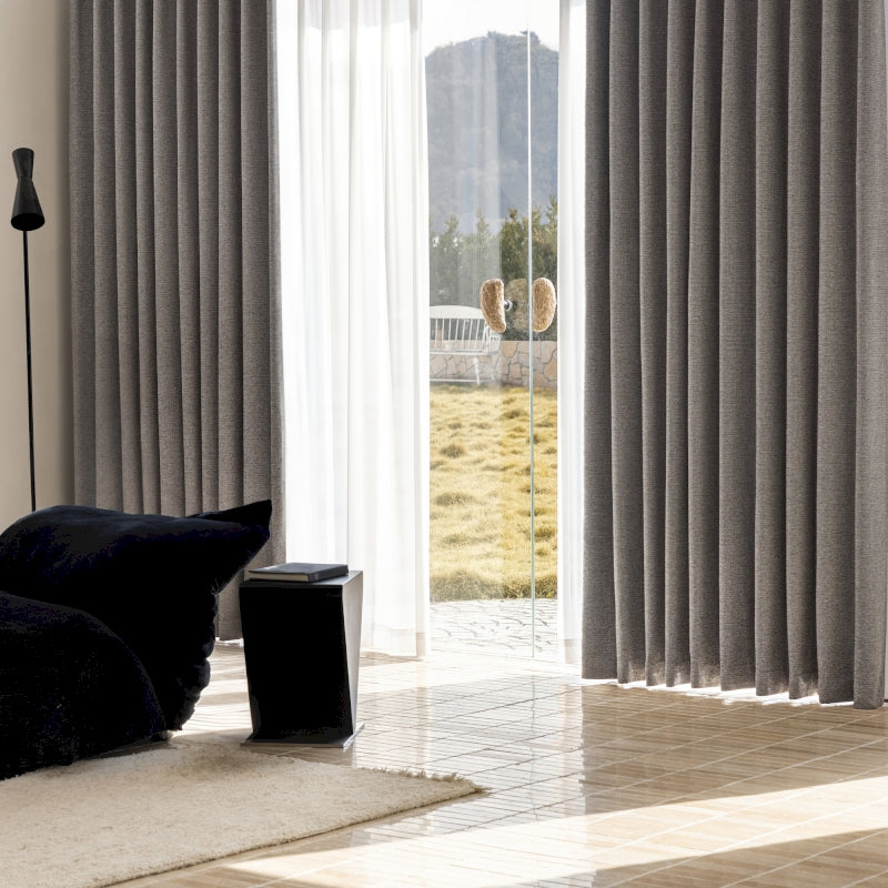 a living room with a large sliding glass door