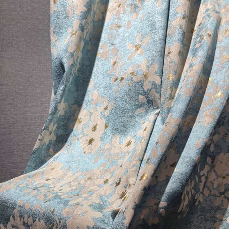 a close up of a chair with a flower pattern on it