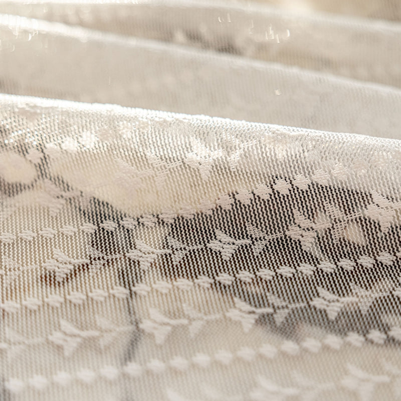 a close up of a piece of cloth with flowers on it