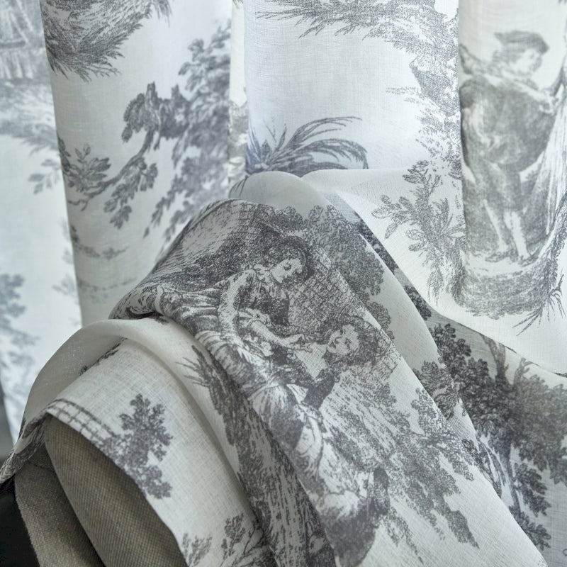 a close up of a chair with a curtain