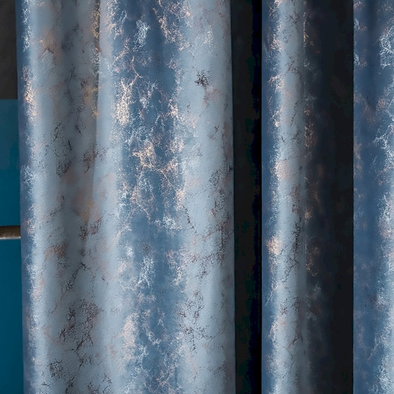 a close up of a curtain with a blue background