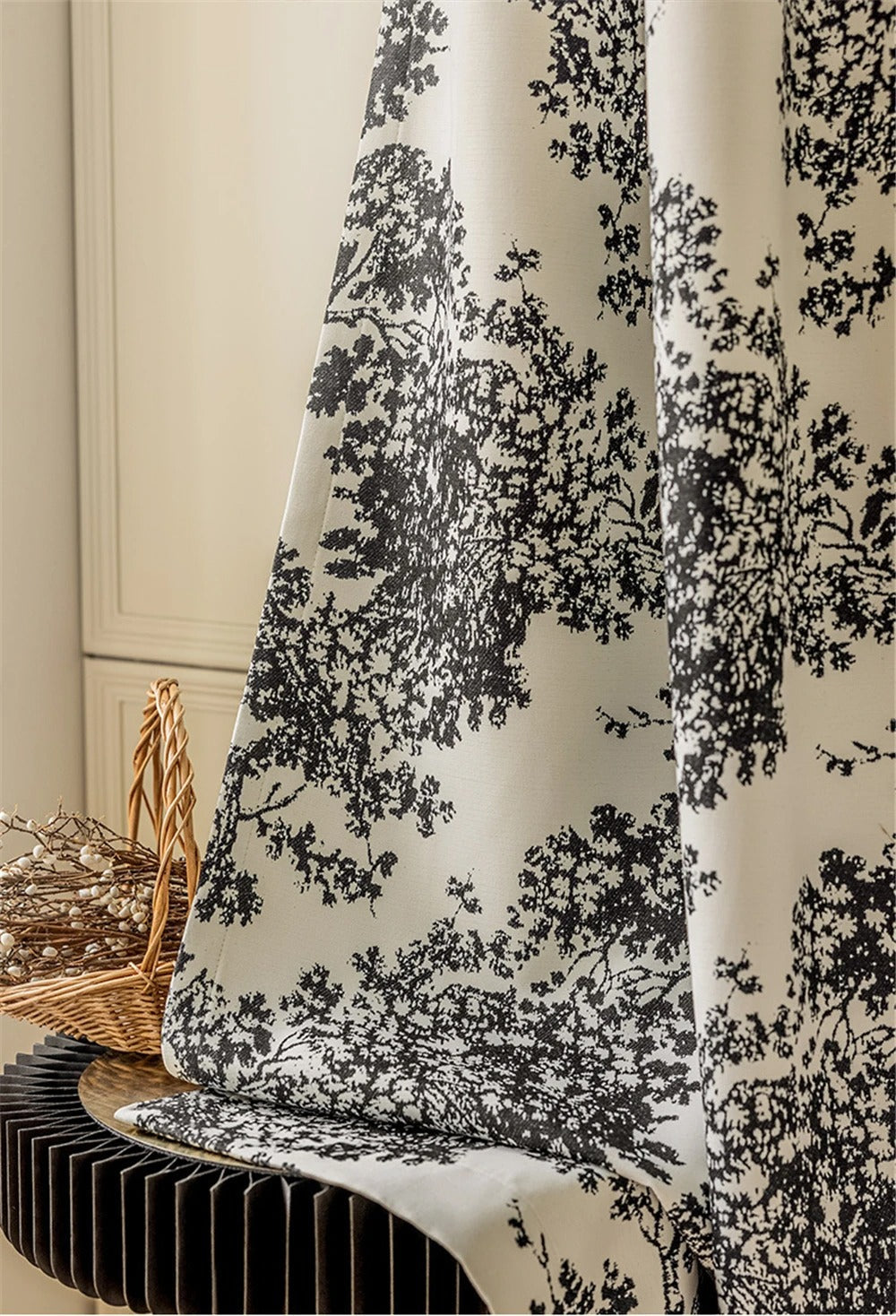 a close up of a curtain with a black and white pattern