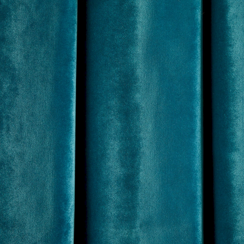 a close up of a blue curtain with a black background