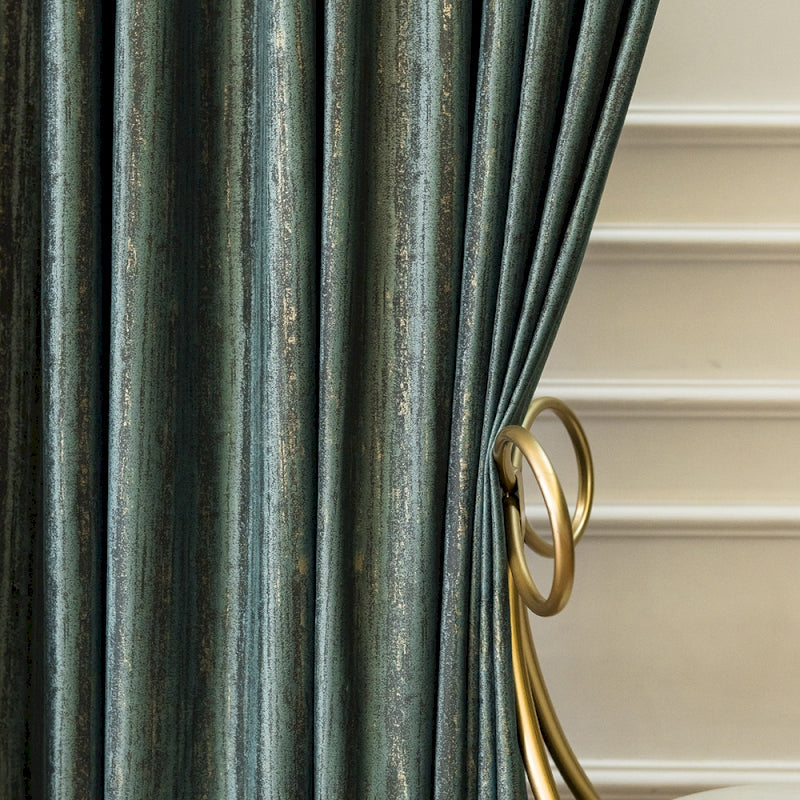 a close up of a curtain with a gold handle