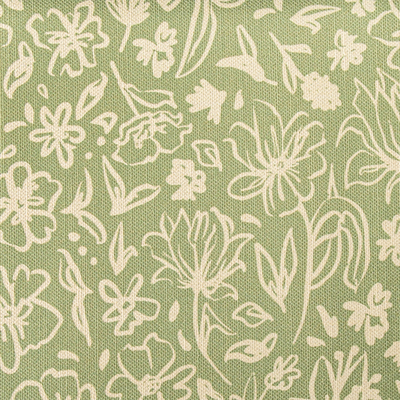 a close up of a green and white fabric with white flowers