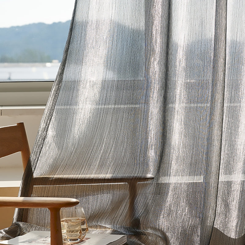 a wooden chair sitting next to a window
