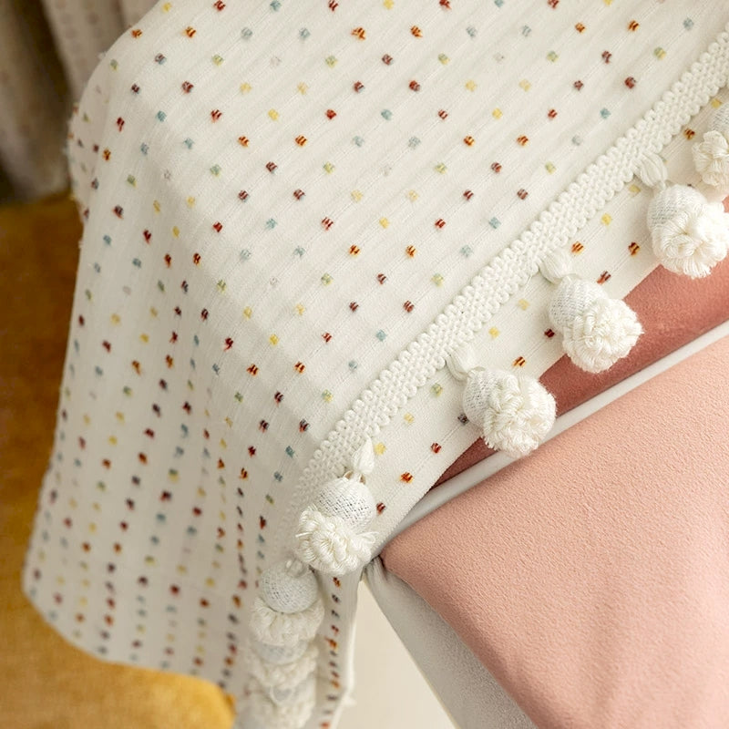 a crib with a blanket and pillow on top of it