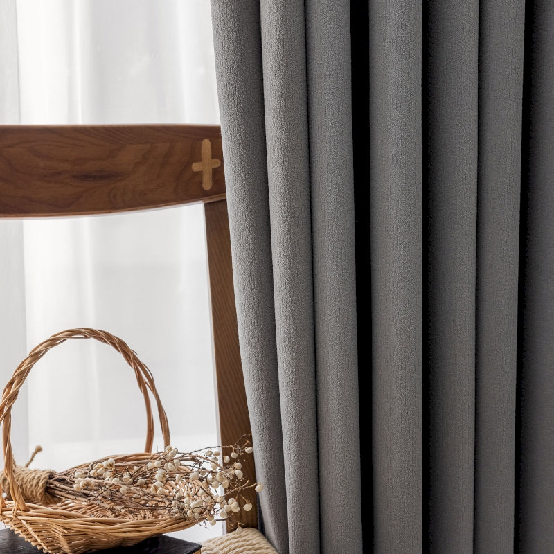 a wooden chair sitting next to a window