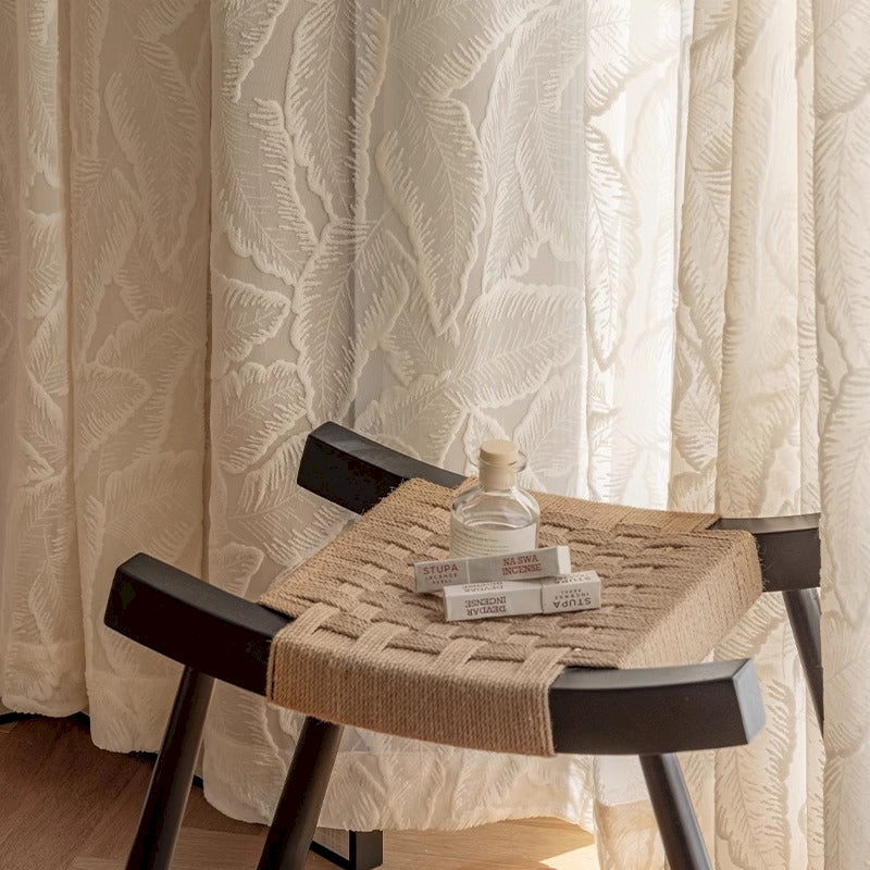 a chair and a table with a bottle on it