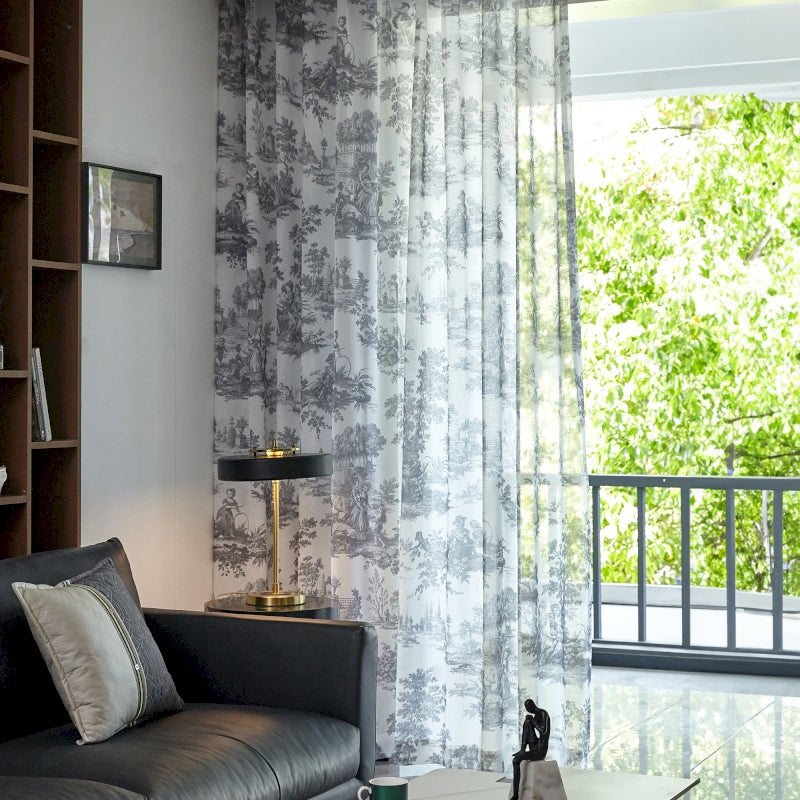 a living room filled with furniture and a large window