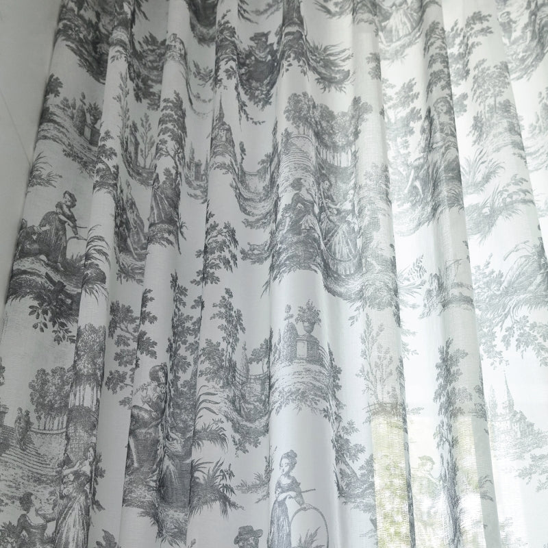 a curtain with a black and white toiler print