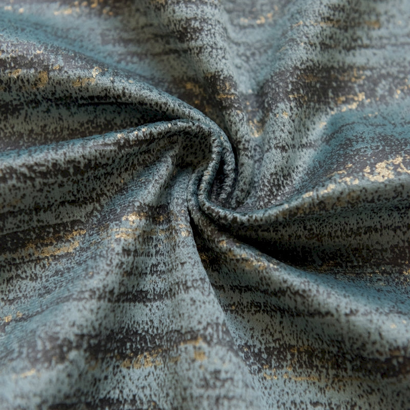 a close up of a blue and gold fabric