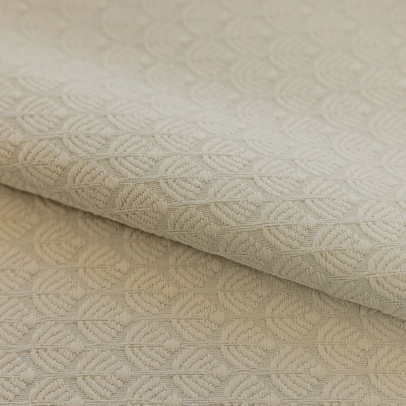 a close up of a white fabric with a pattern