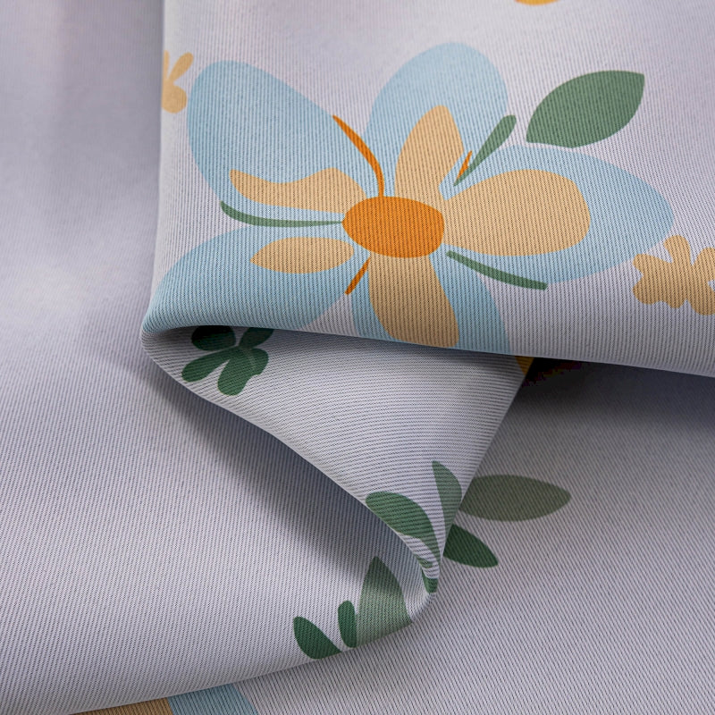 a close up of a flower print on a sheet