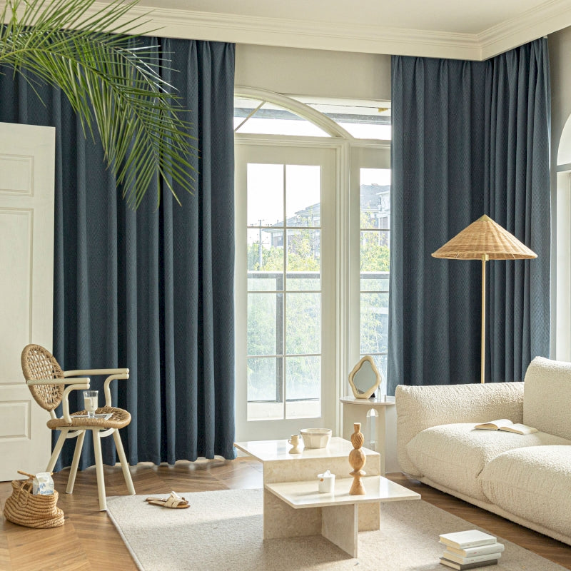 a living room filled with furniture and a large window