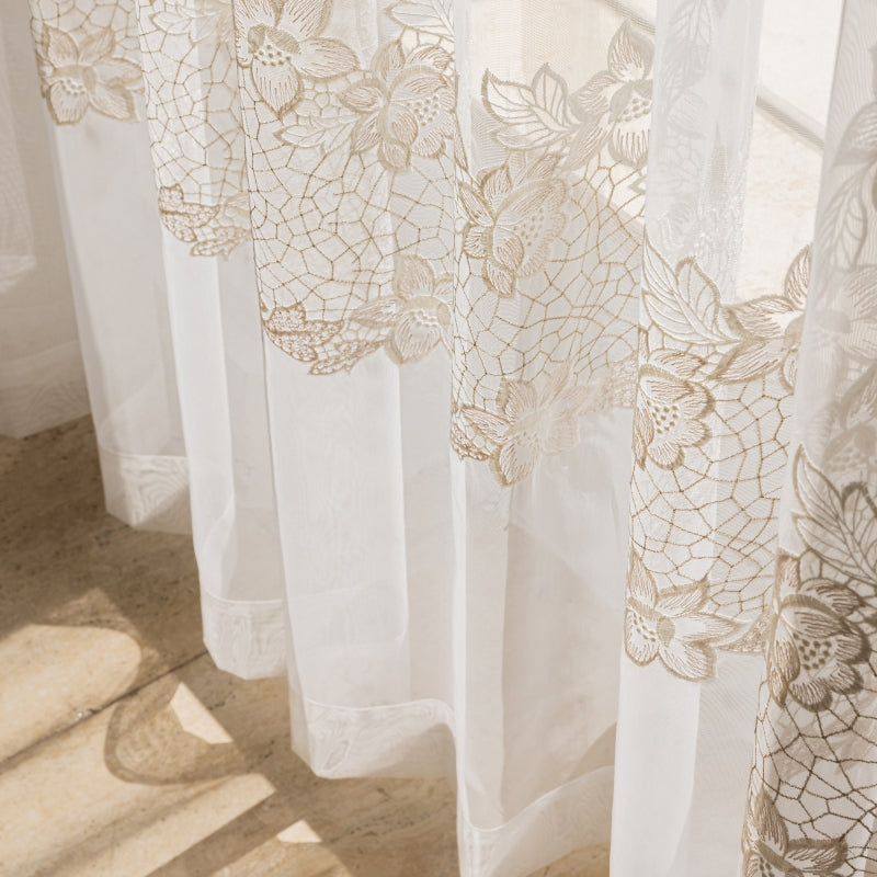 a close up of a window with a curtain