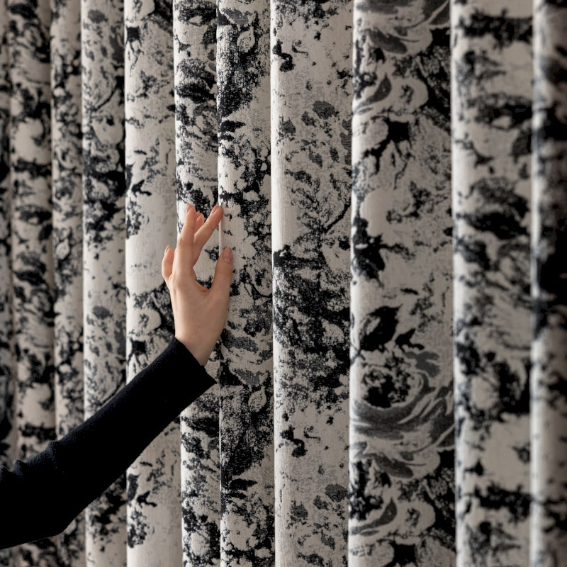 a woman is touching a wall with her hand