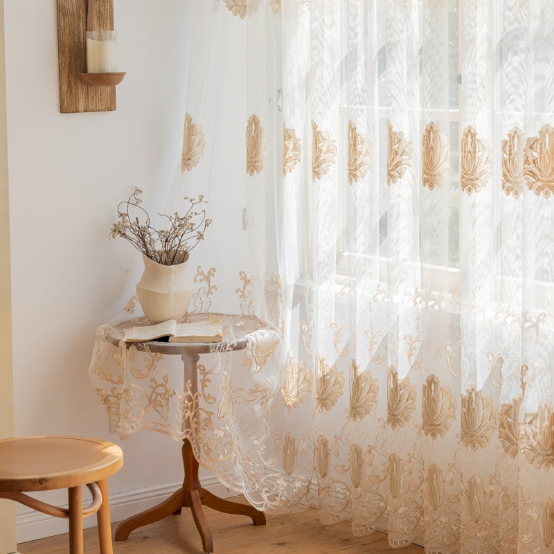 a table with a vase on top of it next to a window
