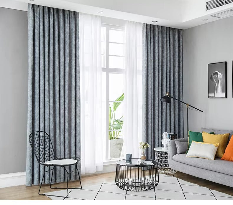 a living room filled with furniture and a large window
